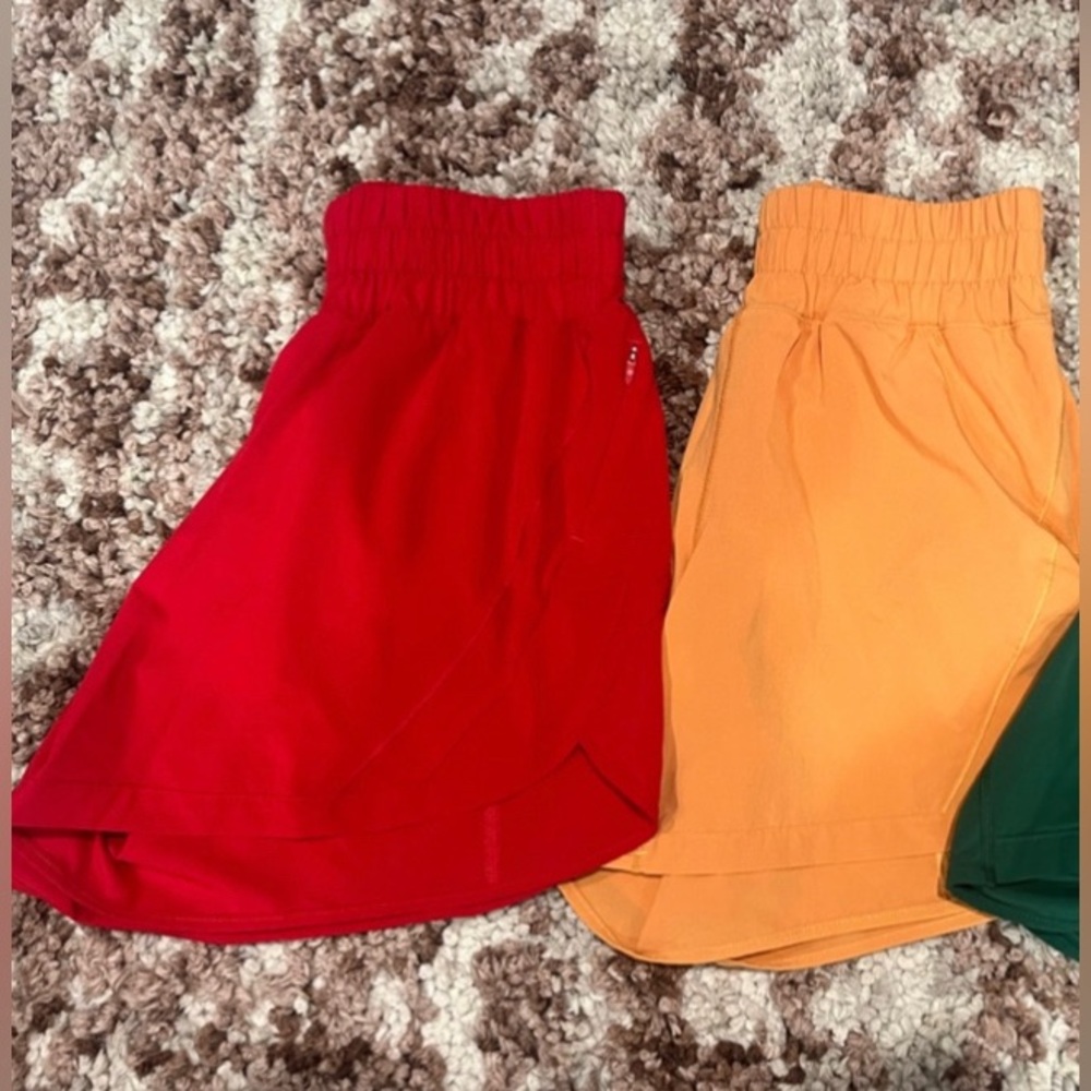 LIKE NEW 2 pairs of lululemon track that 5” shorts size 4